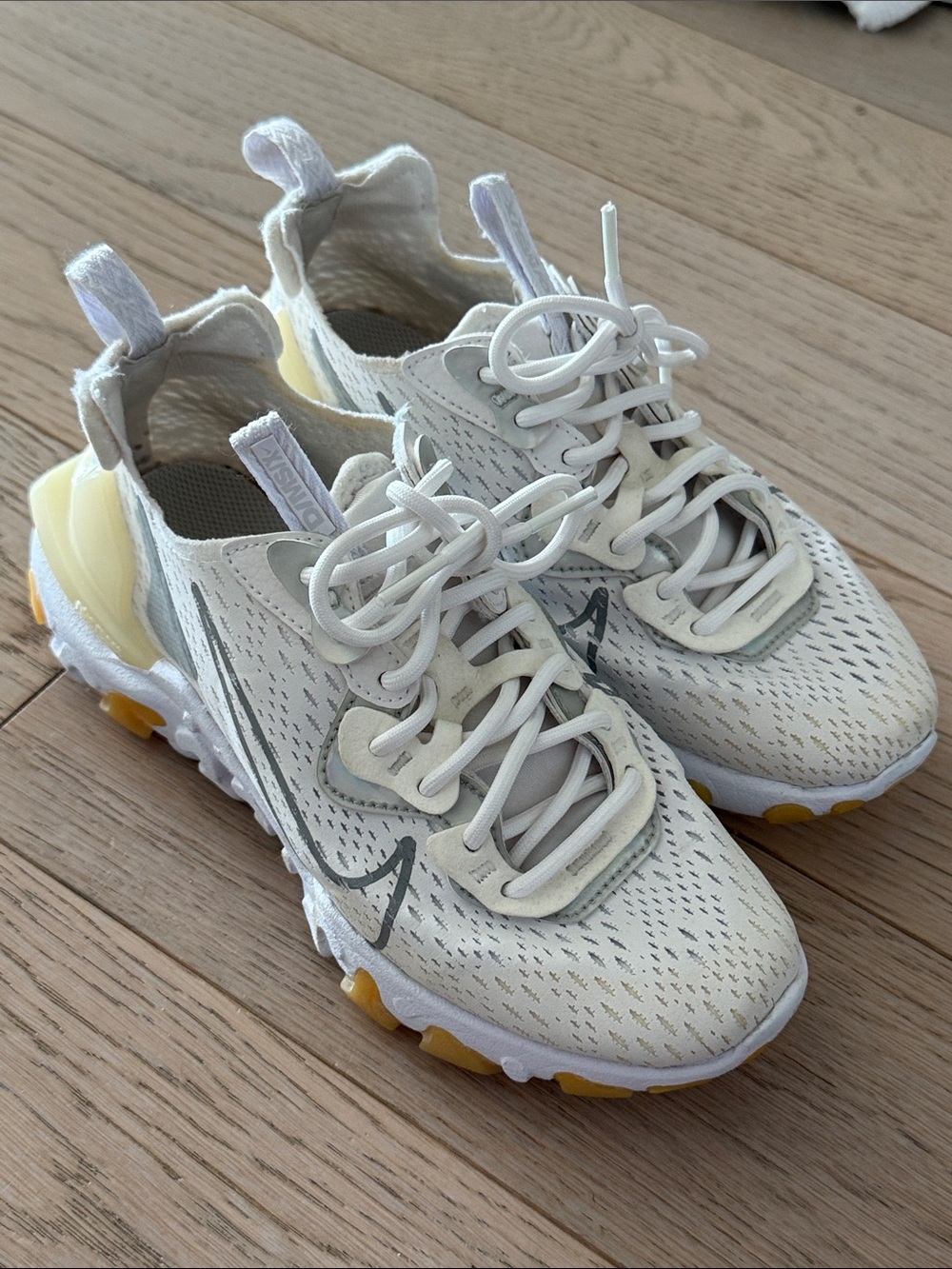 Nike Women's White Sneakers with Pale Yellow Accents